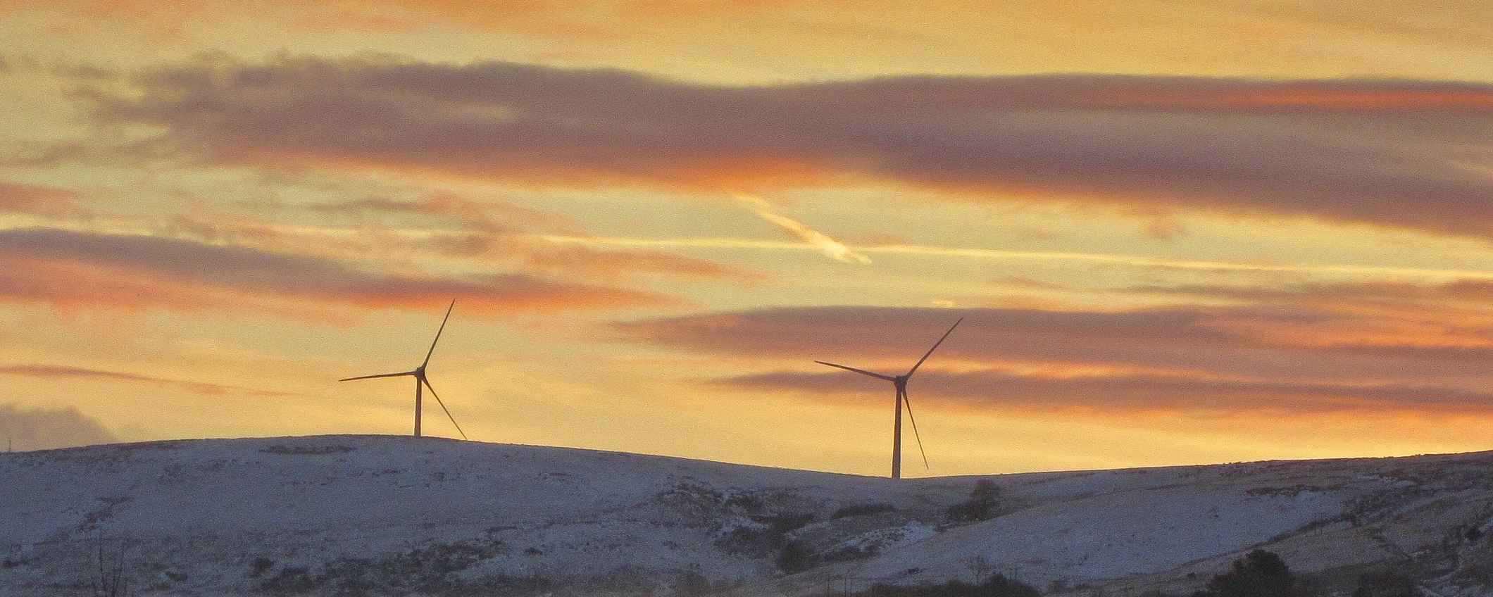Wind energy park in snowy landscape