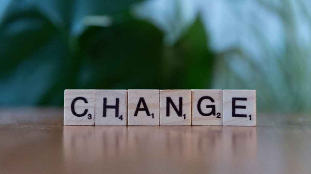 Wooden blocks with letters spelling "Change."