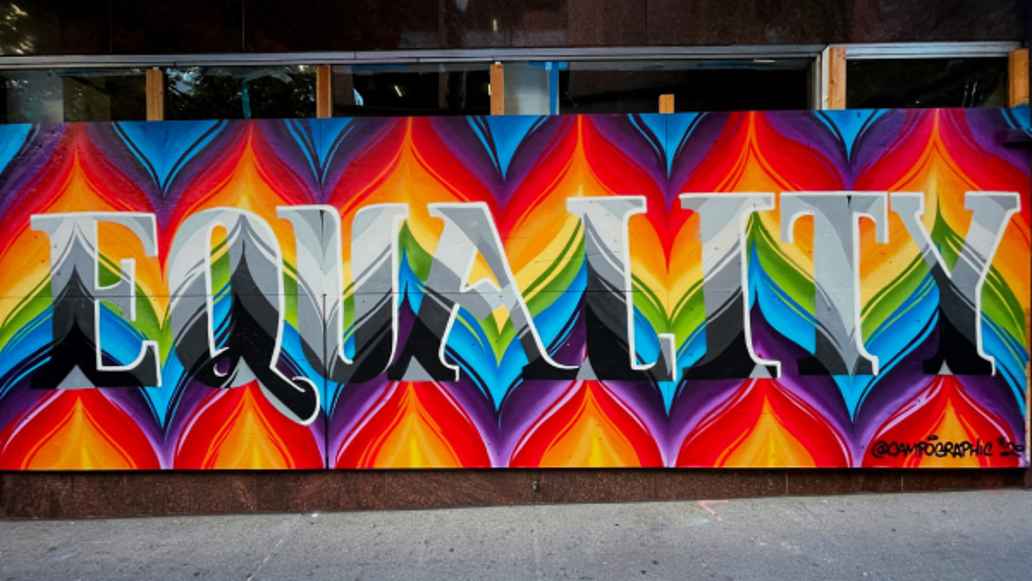 Street art on a wall with the text "Equality."